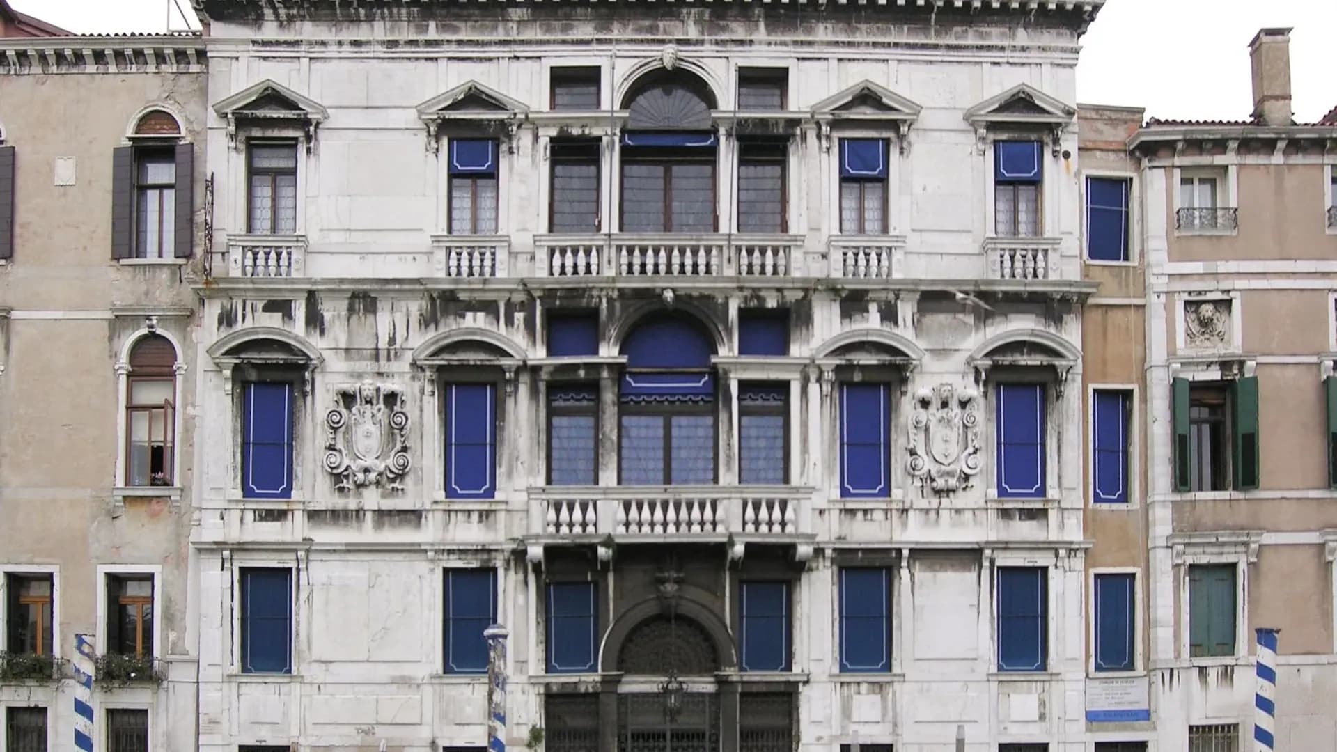 Palazzo Grimani, Venice, facade with arched windows and blue shutters.